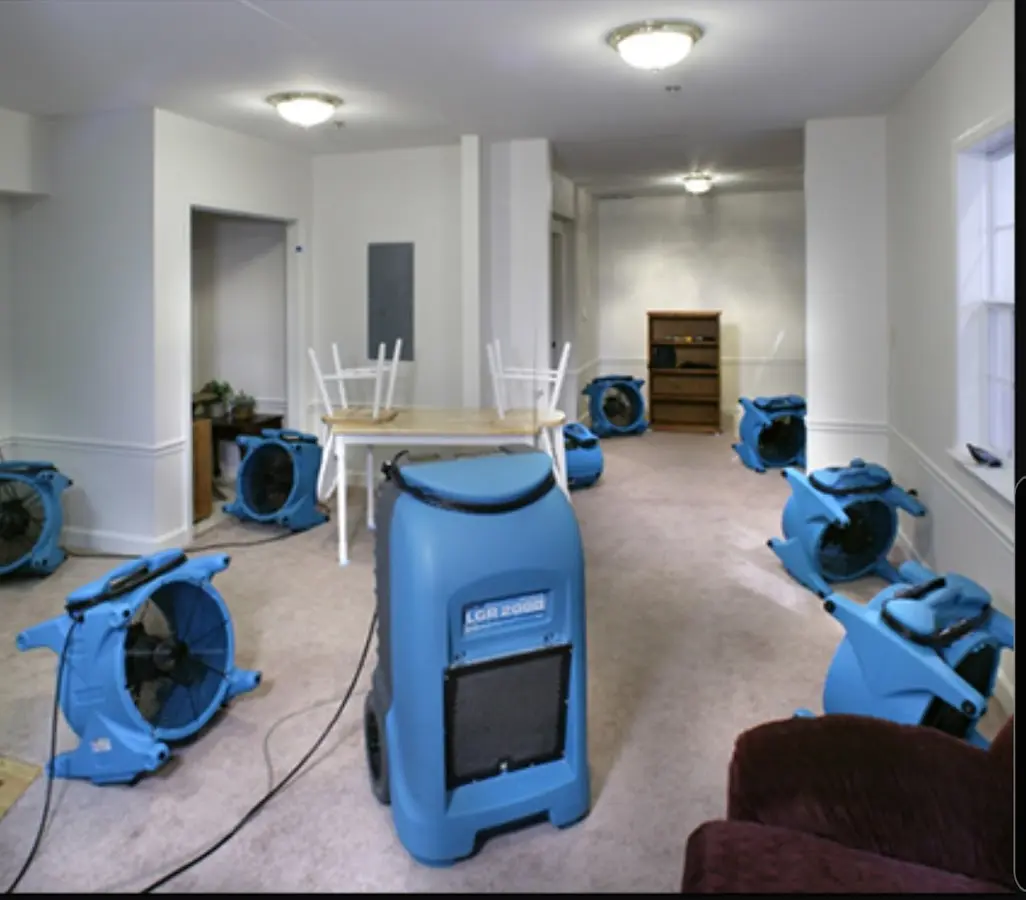 Air movers and dehumidifier setup for Water Extraction & Removal in Bourne